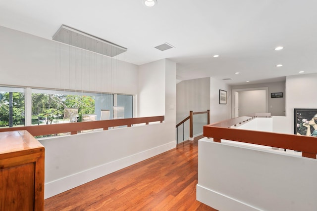 6460 SE Harbor Cir, Stuart, FL 34996 - hall with an upstairs landing, wood finished floors, recessed lighting, and baseboards