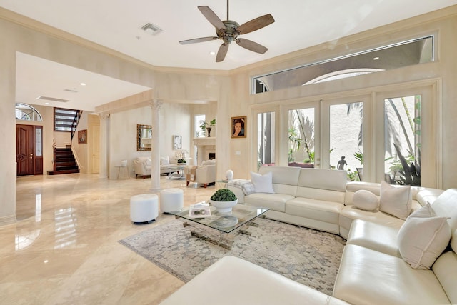 3628 S Ocean Blvd, Highland Beach, FL 33487 - living room with stairs, marble tiled flooring, ornamental molding, ceiling fan, and a fireplace