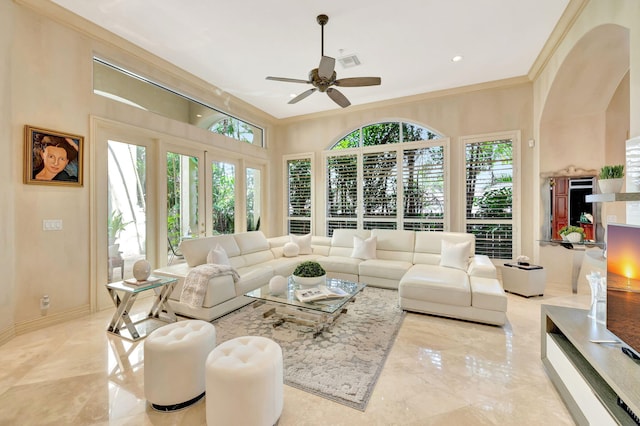 3628 S Ocean Blvd, Highland Beach, FL 33487 - living area with ceiling fan, ornamental molding, and light marble finish floors