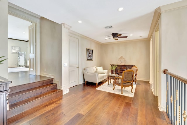 3628 S Ocean Blvd, Highland Beach, FL 33487 - sitting room featuring ceiling fan, wood finished floors, recessed lighting, ornamental molding, and baseboards