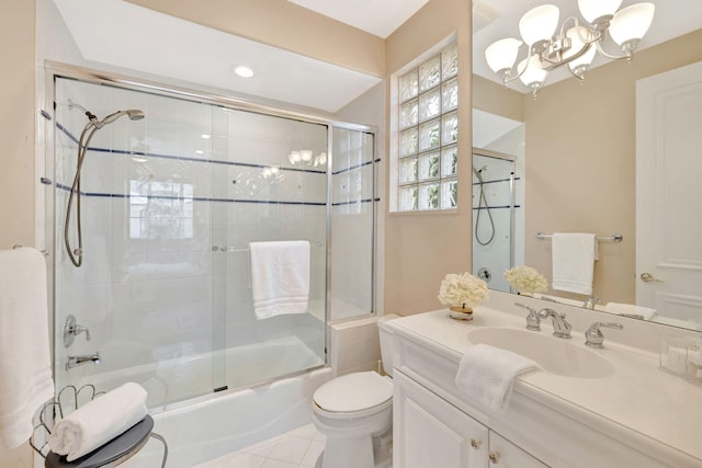 3628 S Ocean Blvd, Highland Beach, FL 33487 - bathroom featuring toilet, enclosed tub / shower combo, vanity, a chandelier, and tile patterned floors