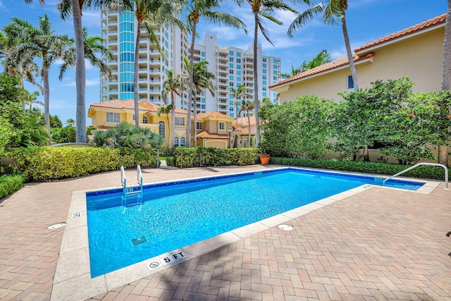 3628 S Ocean Blvd, Highland Beach, FL 33487 - community pool featuring a patio
