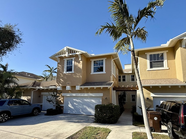 855 Marina Del Ray Ln Unit 2, West Palm Beach, FL 33401 - multi unit property featuring stucco siding, an attached garage, and driveway