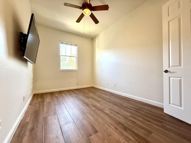 855 Marina Del Ray Ln Unit 2, West Palm Beach, FL 33401 - empty room with dark wood-style flooring, ceiling fan, and baseboards