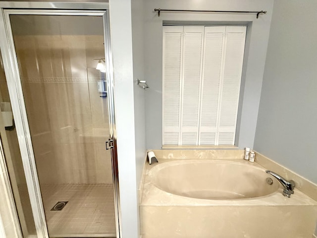 855 Marina Del Ray Ln Unit 2, West Palm Beach, FL 33401 - full bathroom featuring a garden tub and a shower stall
