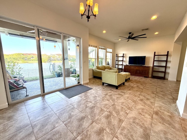855 Marina Del Ray Ln Unit 2, West Palm Beach, FL 33401 - living room featuring a chandelier, recessed lighting, baseboards, a water view, and light tile patterned floors