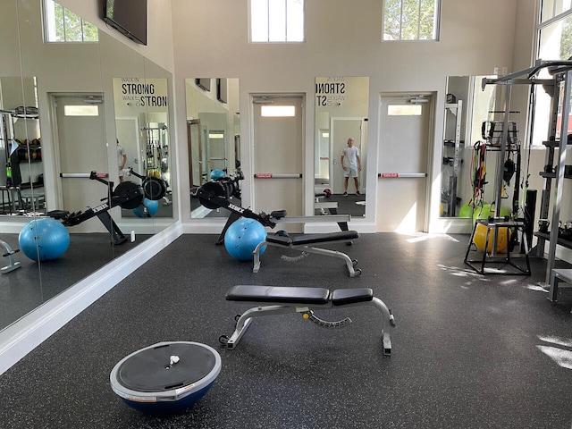 855 Marina Del Ray Ln Unit 2, West Palm Beach, FL 33401 - gym with a towering ceiling and plenty of natural light