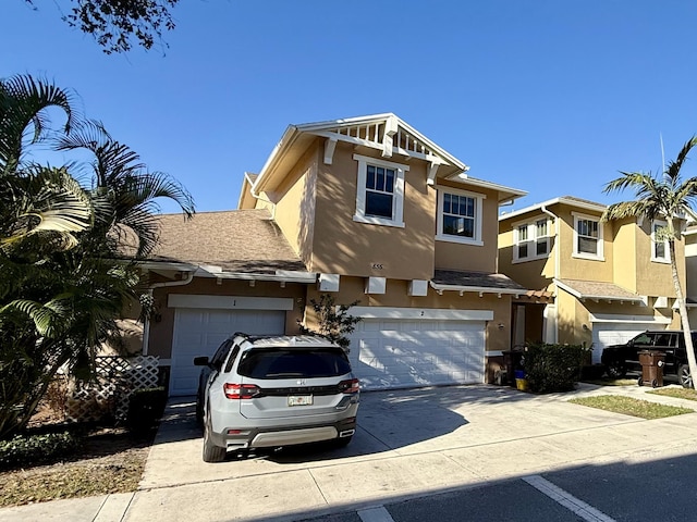 855 Marina Del Ray Ln Unit 2, West Palm Beach, FL 33401 - view of property with stucco siding, driveway, and an attached garage