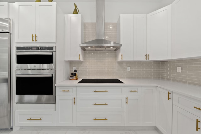 7887 150th Ct N, Palm Beach Gardens, FL 33418 - kitchen with wall chimney exhaust hood, appliances with stainless steel finishes, light countertops, and white cabinets