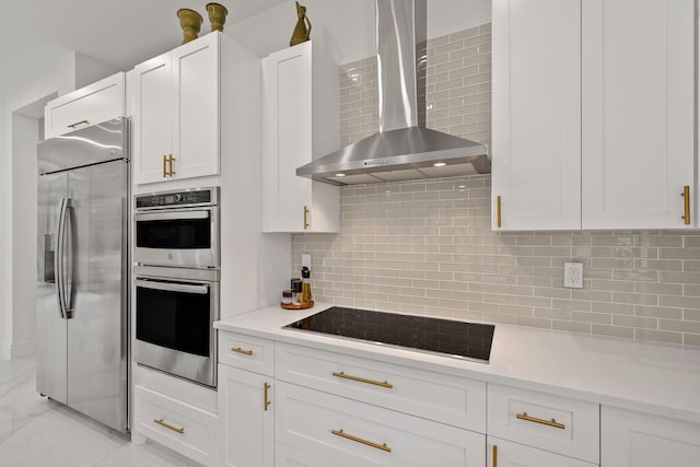 7887 150th Ct N, Palm Beach Gardens, FL 33418 - kitchen featuring appliances with stainless steel finishes, wall chimney exhaust hood, light countertops, and white cabinetry