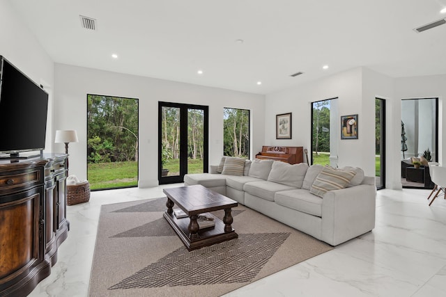 7887 150th Ct N, Palm Beach Gardens, FL 33418 - living area featuring light marble finish flooring and recessed lighting