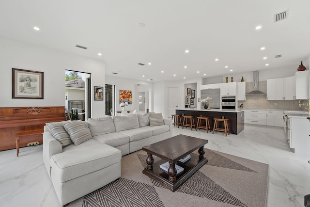 7887 150th Ct N, Palm Beach Gardens, FL 33418 - living area with light marble finish floors and recessed lighting