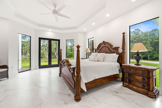 7887 150th Ct N, Palm Beach Gardens, FL 33418 - bedroom featuring recessed lighting, a tray ceiling, light marble finish floors, baseboards, and a ceiling fan