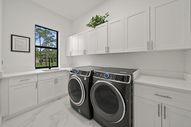 7887 150th Ct N, Palm Beach Gardens, FL 33418 - laundry room with washing machine and clothes dryer, cabinet space, and light marble finish flooring