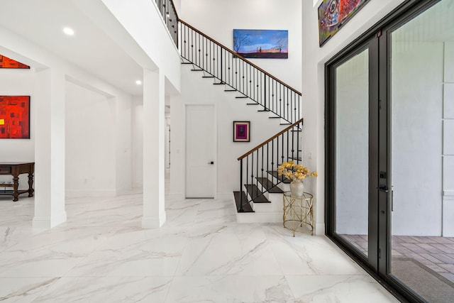 7887 150th Ct N, Palm Beach Gardens, FL 33418 - entryway featuring stairway, marble tiled flooring, a high ceiling, recessed lighting, and baseboards