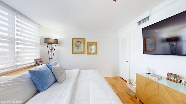 1340 S Ocean Blvd Unit 308, Pompano Beach, FL 33062 - bedroom with light wood-style floors, ornamental molding, and baseboards