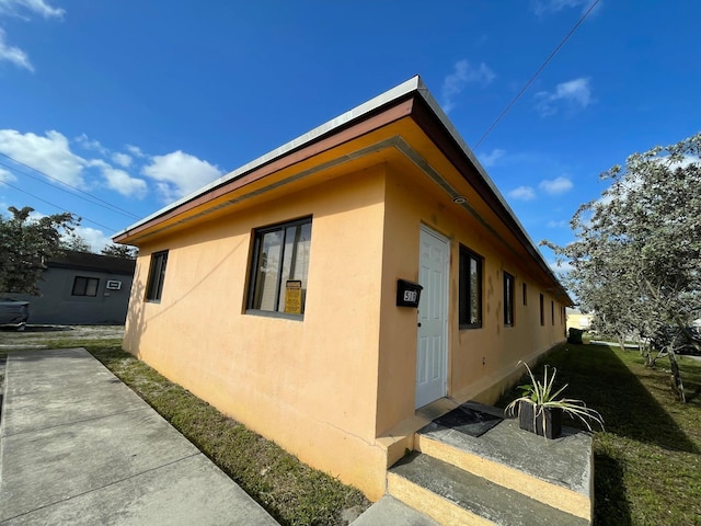 519 NW 3rd Ave Unit 519-521, Hallandale Beach, FL 33009 - view of side of home featuring stucco siding