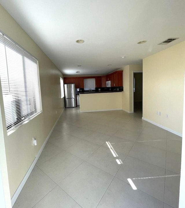 519 NW 3rd Ave Unit 519-521, Hallandale Beach, FL 33009 - unfurnished living room with baseboards, light tile patterned flooring, and recessed lighting