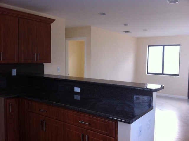 519 NW 3rd Ave Unit 519-521, Hallandale Beach, FL 33009 - kitchen featuring a peninsula and baseboards