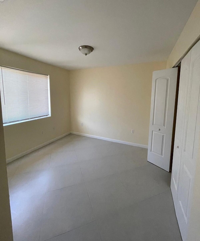 519 NW 3rd Ave Unit 519-521, Hallandale Beach, FL 33009 - tiled spare room with baseboards