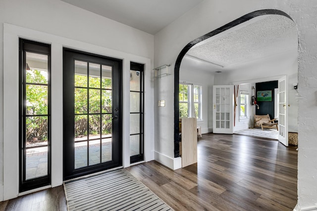 230 Princeton Dr, Lake Worth Beach, FL 33460 - foyer entrance with wood finished floors and arched walkways