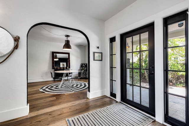 230 Princeton Dr, Lake Worth Beach, FL 33460 - foyer entrance with wood finished floors and arched walkways