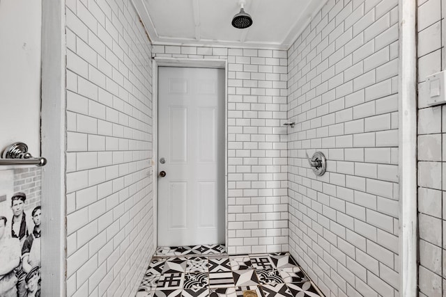 230 Princeton Dr, Lake Worth Beach, FL 33460 - bathroom featuring tile walls, a tile shower, and ornamental molding
