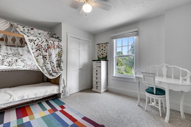 230 Princeton Dr, Lake Worth Beach, FL 33460 - bedroom with carpet flooring, a closet, a textured ceiling, and a ceiling fan