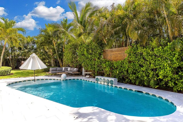230 Princeton Dr, Lake Worth Beach, FL 33460 - outdoor pool with an outdoor living space and a patio area