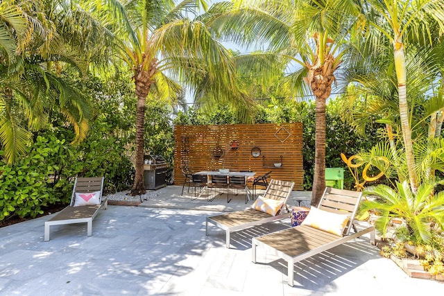 230 Princeton Dr, Lake Worth Beach, FL 33460 - view of patio featuring outdoor dining space and a grill