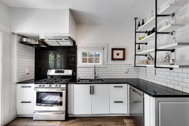 230 Princeton Dr, Lake Worth Beach, FL 33460 - kitchen with appliances with stainless steel finishes, backsplash, open shelves, dark countertops, and white cabinets