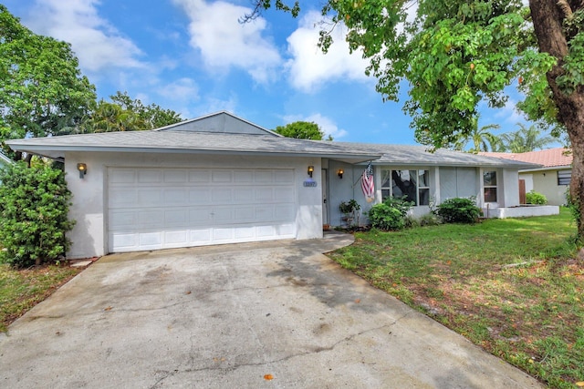 1197 Belmore Ter, Wellington, FL 33414 - single story home featuring stucco siding, driveway, a front lawn, and a garage