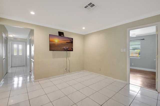 1197 Belmore Ter, Wellington, FL 33414 - spare room with plenty of natural light, light tile patterned floors, baseboards, ornamental molding, and recessed lighting