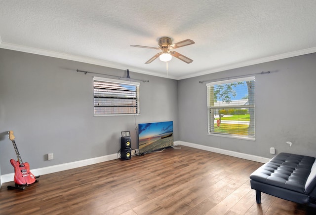 1197 Belmore Ter, Wellington, FL 33414 - sitting room featuring ceiling fan, ornamental molding, a textured ceiling, wood finished floors, and baseboards