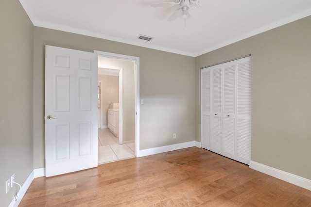 1197 Belmore Ter, Wellington, FL 33414 - unfurnished bedroom with a closet, light wood-style flooring, baseboards, ornamental molding, and a ceiling fan