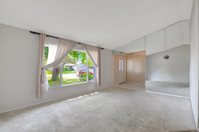 1197 Belmore Ter, Wellington, FL 33414 - spare room featuring carpet floors and lofted ceiling