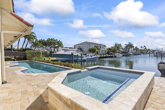 3819 N Ocean Dr, Singer Island, FL 33404 - outdoor pool featuring an in-ground hot tub, a water view, and a patio area