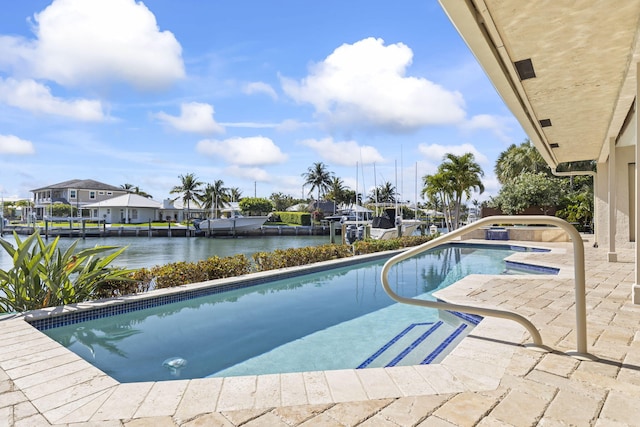 3819 N Ocean Dr, Singer Island, FL 33404 - outdoor pool with a water view, a jacuzzi, and a patio area