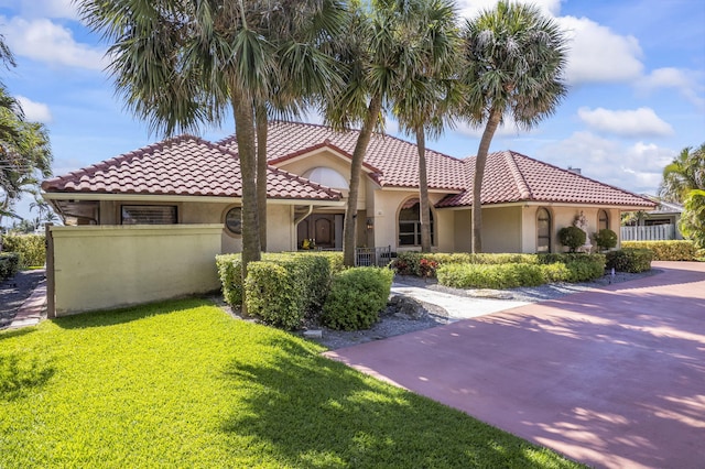 3819 N Ocean Dr, Singer Island, FL 33404 - mediterranean / spanish home featuring stucco siding and a tile roof