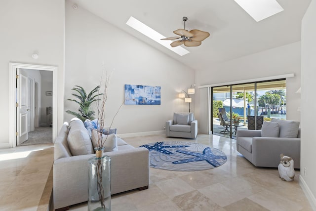 3819 N Ocean Dr, Singer Island, FL 33404 - living area with a skylight, high vaulted ceiling, and baseboards