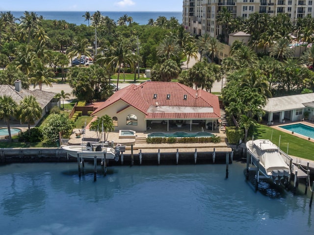 3819 N Ocean Dr, Singer Island, FL 33404 - dock area with boat lift and a water view