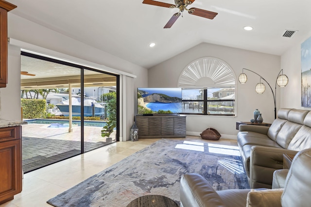 3819 N Ocean Dr, Singer Island, FL 33404 - living area featuring a ceiling fan, lofted ceiling, light tile patterned floors, and recessed lighting