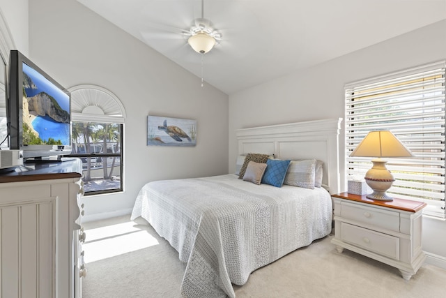 3819 N Ocean Dr, Singer Island, FL 33404 - bedroom with light carpet, vaulted ceiling, baseboards, and ceiling fan
