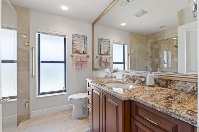 3819 N Ocean Dr, Singer Island, FL 33404 - full bathroom featuring vanity, toilet, baseboards, a stall shower, and plenty of natural light