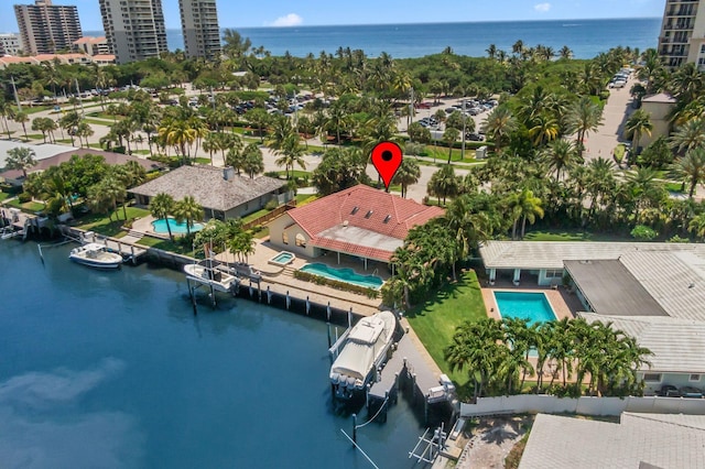 3819 N Ocean Dr, Singer Island, FL 33404 - drone / aerial view of a nearby body of water and a pool area