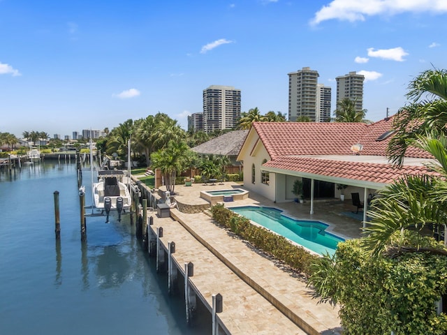 3819 N Ocean Dr, Singer Island, FL 33404 - dock featuring an in-ground hot tub, a patio area, a water view, a city view, and boat lift