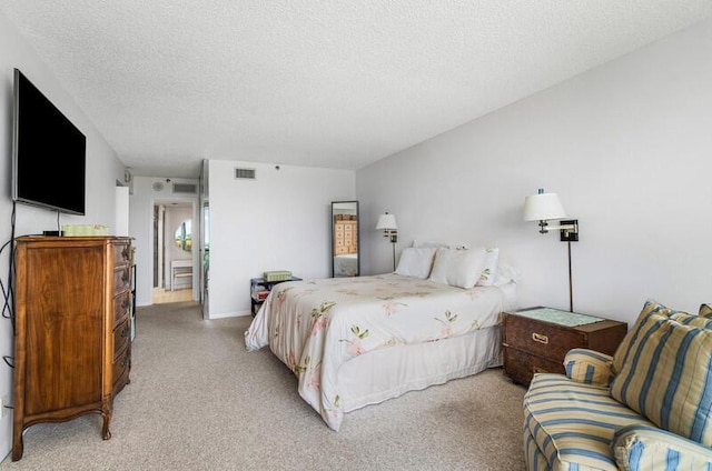 1900 Consulate Pl Unit 402, West Palm Beach, FL 33401 - bedroom with light colored carpet and a textured ceiling
