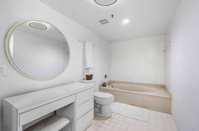 1900 Consulate Pl Unit 402, West Palm Beach, FL 33401 - bathroom featuring a tub to relax in, toilet, vanity, and tile patterned flooring