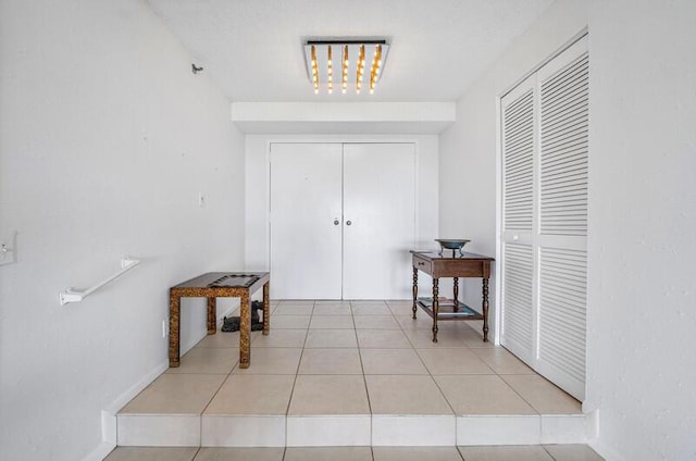 1900 Consulate Pl Unit 402, West Palm Beach, FL 33401 - corridor with tile patterned floors