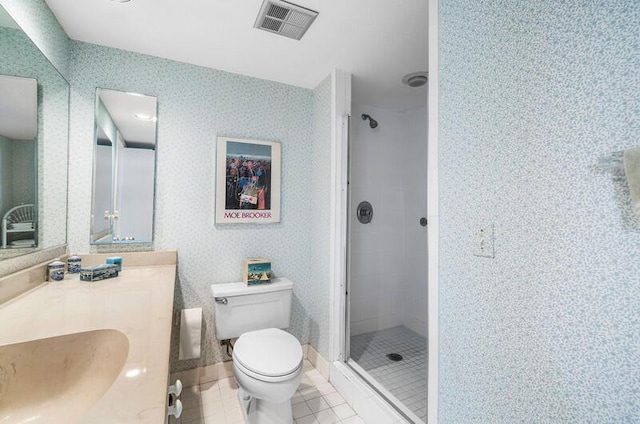 1900 Consulate Pl Unit 402, West Palm Beach, FL 33401 - full bathroom with a stall shower, vanity, toilet, wallpapered walls, and tile patterned floors